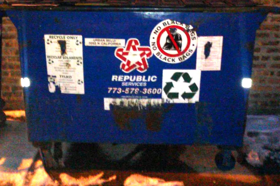 A blue Republic Services front-load bin with the red and blue star logo